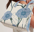 Ted Baker London cream tote bag with blue floral print and light blue handles